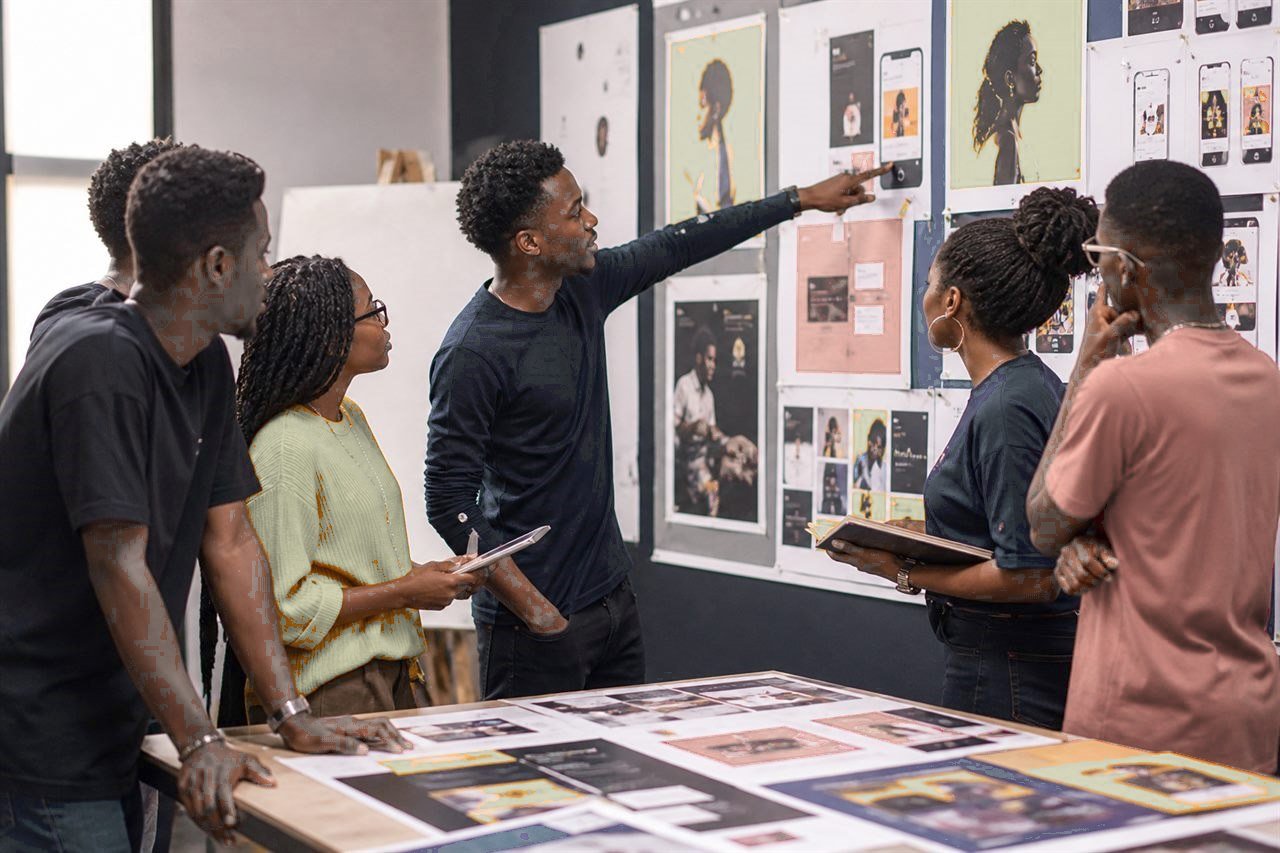 Students reviewing campaign posters and mockups.